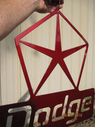 Dodge metal sign in Wilder Red over Super Chrome