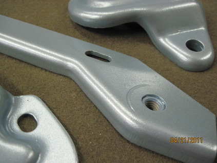 Close up of Mopar seat brackets in Poncho Blue