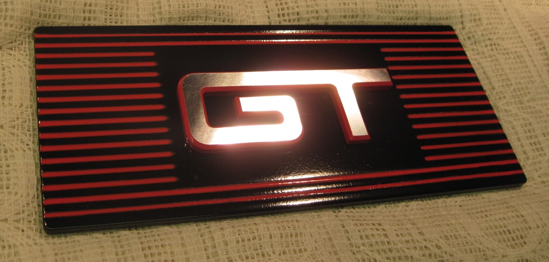 Cobra fuse box cover in Flame Red, Ink Black and Clear Vision with custom matching billet GT emblem