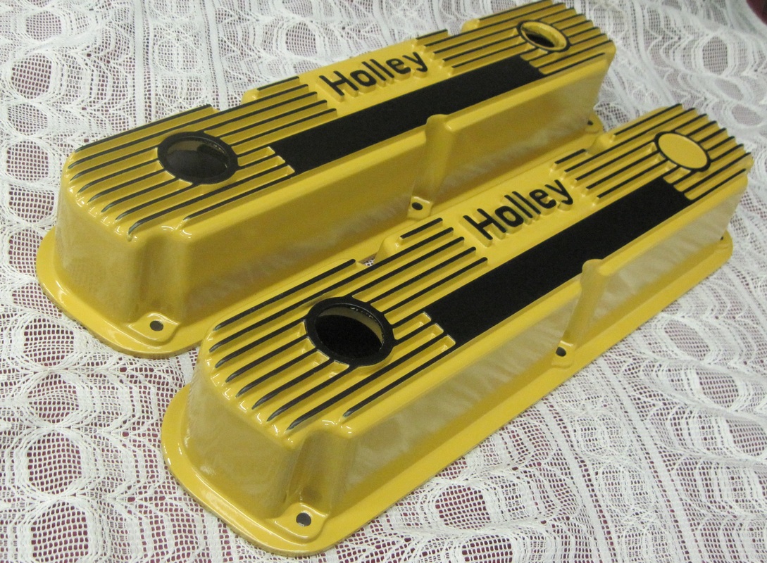 Close up of Holley valve covers in Corsair Gold and Silk Satin Black