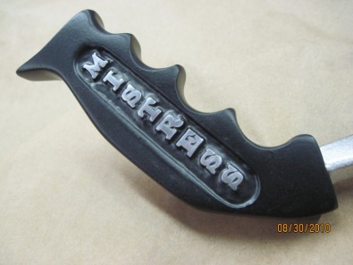 Close up of custom 'Mistress' shifter handle in Silk Satin Black